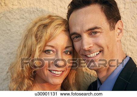 Portrait of a mature couple smiling View Large Photo Image Stock Image - Portrait of a mature couple smiling. Fotosearch
