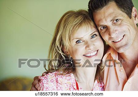 Stock Photograph - Portrait of a mature couple smiling. Fotosearch
