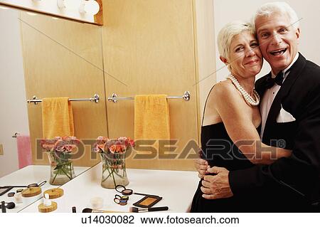 Portrait Of A Man And Senior Woman Embracing Each Other Man And A Senior Woman Embracing