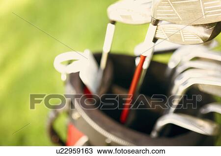 Stock Image - Close-up of golf clubs in a golf bag. Fotosearch
