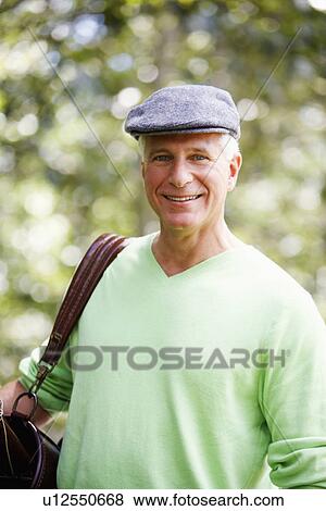 Stock Photo - Portrait of a mature man smiling. Fotosearch