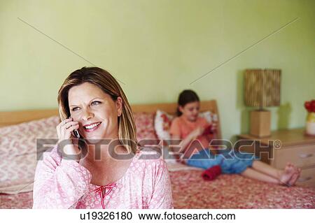 Close-up of a mature woman talking on a mobile phone View Large Photo Image Stock Image - Close-up of a mature woman talking on a mobile phone. Fotosearch