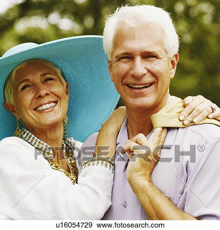 Close-up of a mature man and a senior woman smiling View Large Photo Image Stock Photo - Close-up of a mature man and a senior woman smiling. Fotosearch