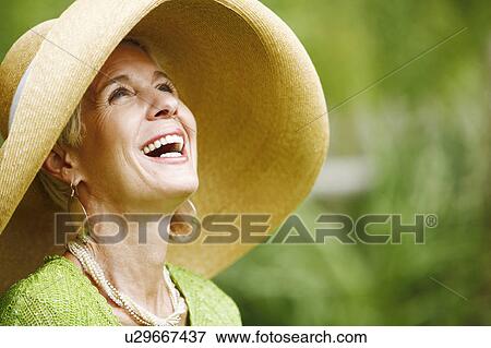 Close-up of a senior woman laughing View Large Photo Image Stock Photo - Close-up of a senior woman laughing. Fotosearch