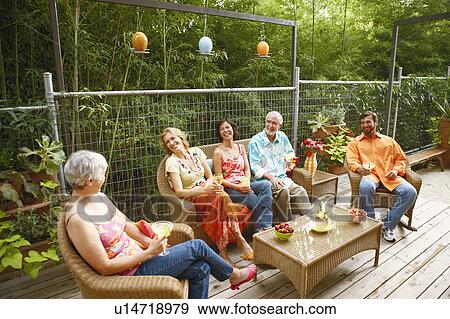 Five people sitting together and smiling View Large Photo Image Stock Photo - Five people sitting together and smiling. Fotosearch