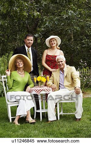 Portrait of a mature couple smiling with a mature man and a senior woman View Large Photo Image Stock Photography - Portrait of a mature couple smiling with a mature man and a senior woman. Fotosearch