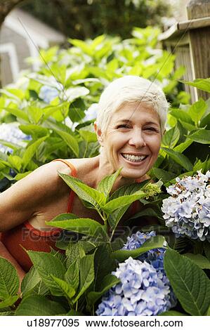 Portrait of a senior woman smiling View Large Photo Image Stock Photography - Portrait of a senior woman smiling. Fotosearch