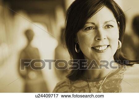 Stock Photo - Close-up of a mature woman smiling. Fotosearch