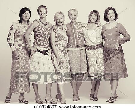 Stock Photo - Portrait of a group of mature women standing and smiling. Fotosearch
