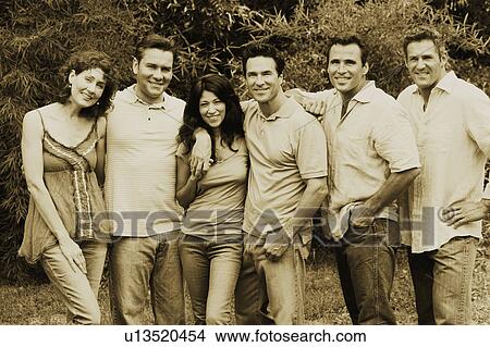 Picture - Portrait of a group of people standing together and posing. Fotosearch