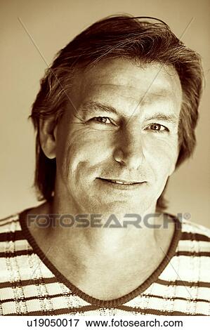 Stock Photo - Portrait of a mature man smiling. Fotosearch