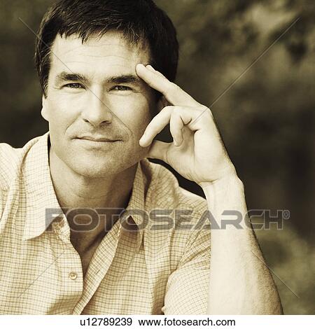 Stock Photo - Portrait of a mature man thinking. Fotosearch