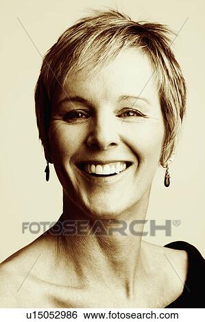Stock Photograph - Portrait of a mature woman smiling. Fotosearch