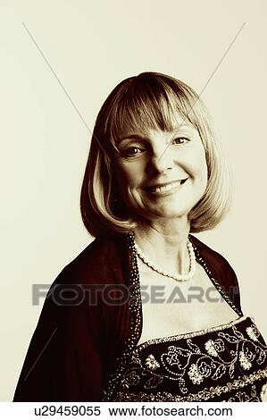 Stock Photography - Portrait of a mature woman smiling. Fotosearch