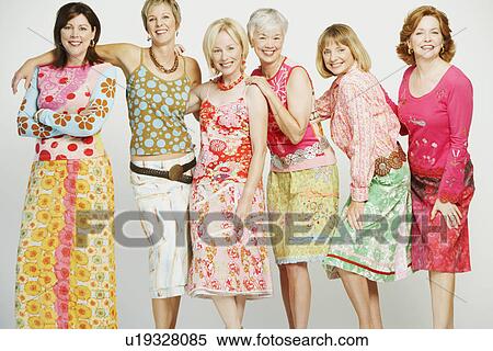 Portrait of a group of mature women standing and smiling View Large Photo Image Stock Photography - Portrait of a group of mature women standing and smiling. Fotosearch