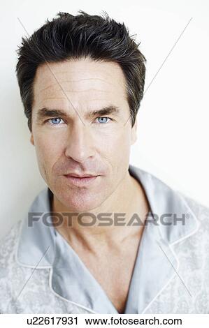 Stock Image - Portrait of a mature man looking serious. Fotosearch