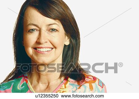 Portrait of a mature woman smiling View Large Photo Image Stock Image - Portrait of a mature woman smiling. Fotosearch
