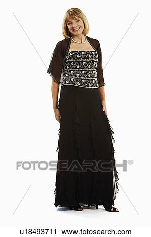 Portrait of a mature woman standing View Large Photo Image Stock Image - Portrait of a mature woman standing. Fotosearch
