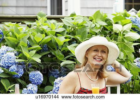 Picture - Close-up of a mature woman smiling. Fotosearch