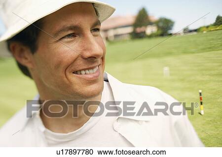 Stock Image - Close-up of a mid adult man smiling. Fotosearch
