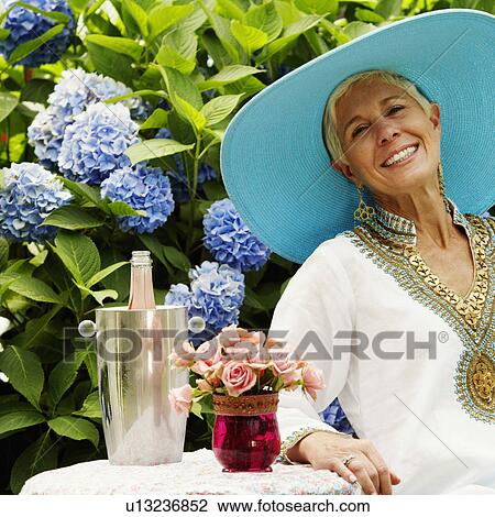 Close-up of a senior woman smiling View Large Photo Image Stock Image - Close-up of a senior woman smiling. Fotosearch