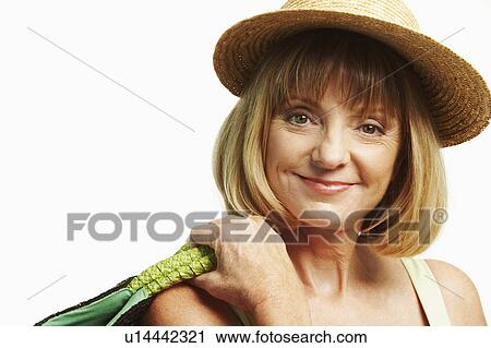 Stock Image - Portrait of a mature woman grinning. Fotosearch