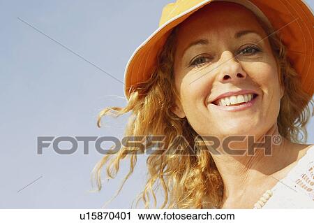 Stock Image - Portrait of a mature woman smiling. Fotosearch