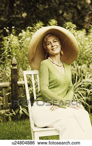 Portrait of a senior woman smiling View Large Photo Image Stock Photograph - Portrait of a senior woman smiling. Fotosearch
