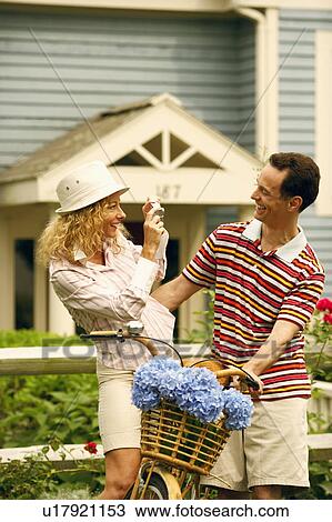 Mature woman taking a photograph of a mature man View Large Photo Image Stock Image - Mature woman taking a photograph of a mature man. Fotosearch