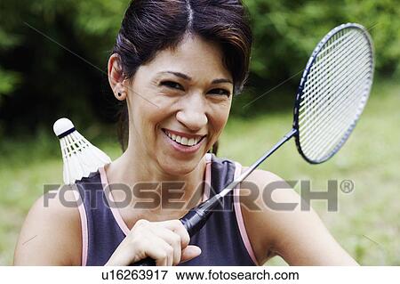 Portrait of a mature woman playing badminton View Large Photo Image Stock Photo - Portrait of a mature woman playing badminton. Fotosearch