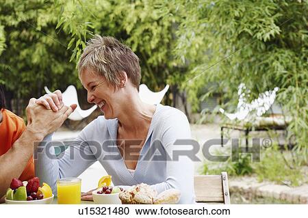 Close-up of a mature woman arm wrestling with a mature man View Large Photo Image Stock Image - Close-up of a mature woman arm wrestling with a mature man. Fotosearch