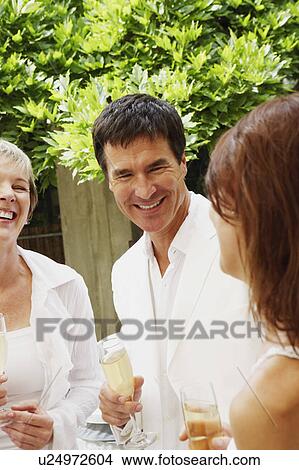 Picture - Mature couple celebrating with champagne. Fotosearch