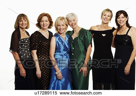 Stock Photography - Portrait of a group of mature women standing together and smiling. Fotosearch