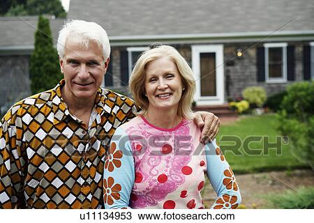 Portrait of a mature couple smiling View Large Photo Image Stock Image - Portrait of a mature couple smiling. Fotosearch