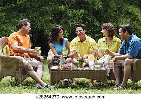 Three mature men and two mature women sitting together View Large Photo Image Stock Image - Three mature men and two mature women sitting together. Fotosearch