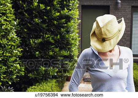 Close-up of a mature woman wearing a cowboy hat View Large Photo Image Picture - Close-up of a mature woman wearing a cowboy hat. Fotosearch