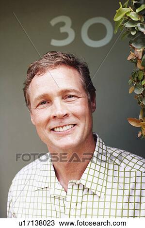Stock Image - Portrait of a mature man smiling. Fotosearch
