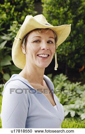 Portrait of a mature woman smiling View Large Photo Image Stock Image - Portrait of a mature woman smiling. Fotosearch