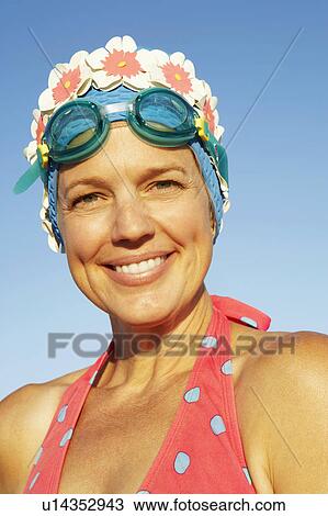 Stock Image - Portrait of a mature woman smiling. Fotosearch