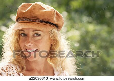Portrait of a mature woman smiling View Large Photo Image Stock Image - Portrait of a mature woman smiling. Fotosearch