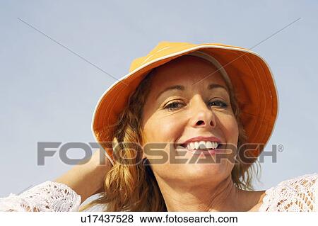 Portrait of a mature woman smiling View Large Photo Image Stock Photo - Portrait of a mature woman smiling. Fotosearch