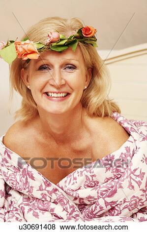 Portrait of a mature woman smiling View Large Photo Image Stock Photo - Portrait of a mature woman smiling. Fotosearch