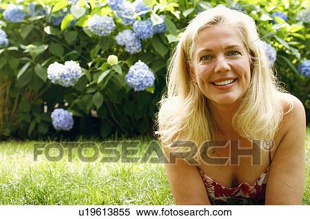 Stock Photography - Portrait of a mature woman smiling. Fotosearch