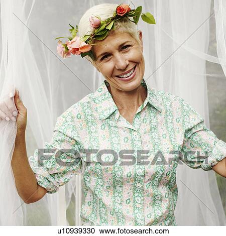 Stock Image - Portrait of a senior woman smiling. Fotosearch