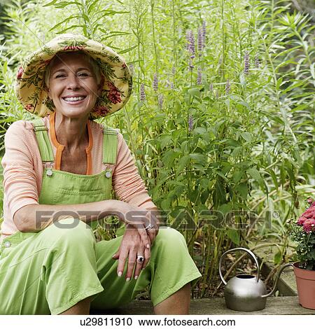 Portrait of a senior woman smiling View Large Photo Image Stock Image - Portrait of a senior woman smiling. Fotosearch