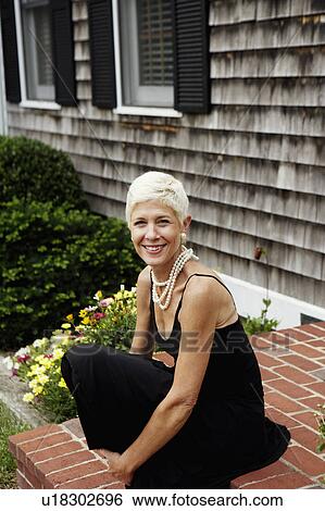 Portrait of a senior woman smiling View Large Photo Image Stock Photograph - Portrait of a senior woman smiling. Fotosearch