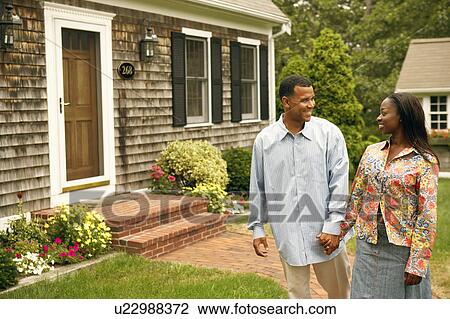 Mature man standing with a mid adult woman and smiling View Large Photo Image Stock Image - Mature man standing with a mid adult woman and smiling. Fotosearch
