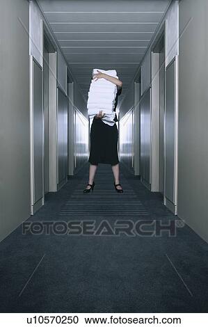 Housekeeper carrying a stack of towels View Large Photo Image Stock Image - Housekeeper carrying a stack of towels. Fotosearch