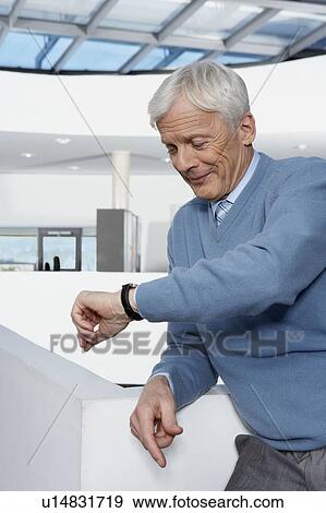 Man leaning against balustrade View Large Photo Image Stock Photo - Man leaning against balustrade. Fotosearch