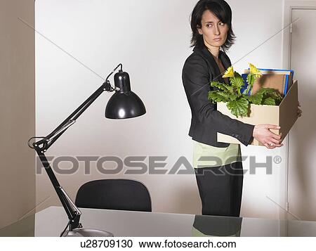Woman with office furniture in a box View Large Photo Image Stock Image - Woman with office furniture in a box. Fotosearch